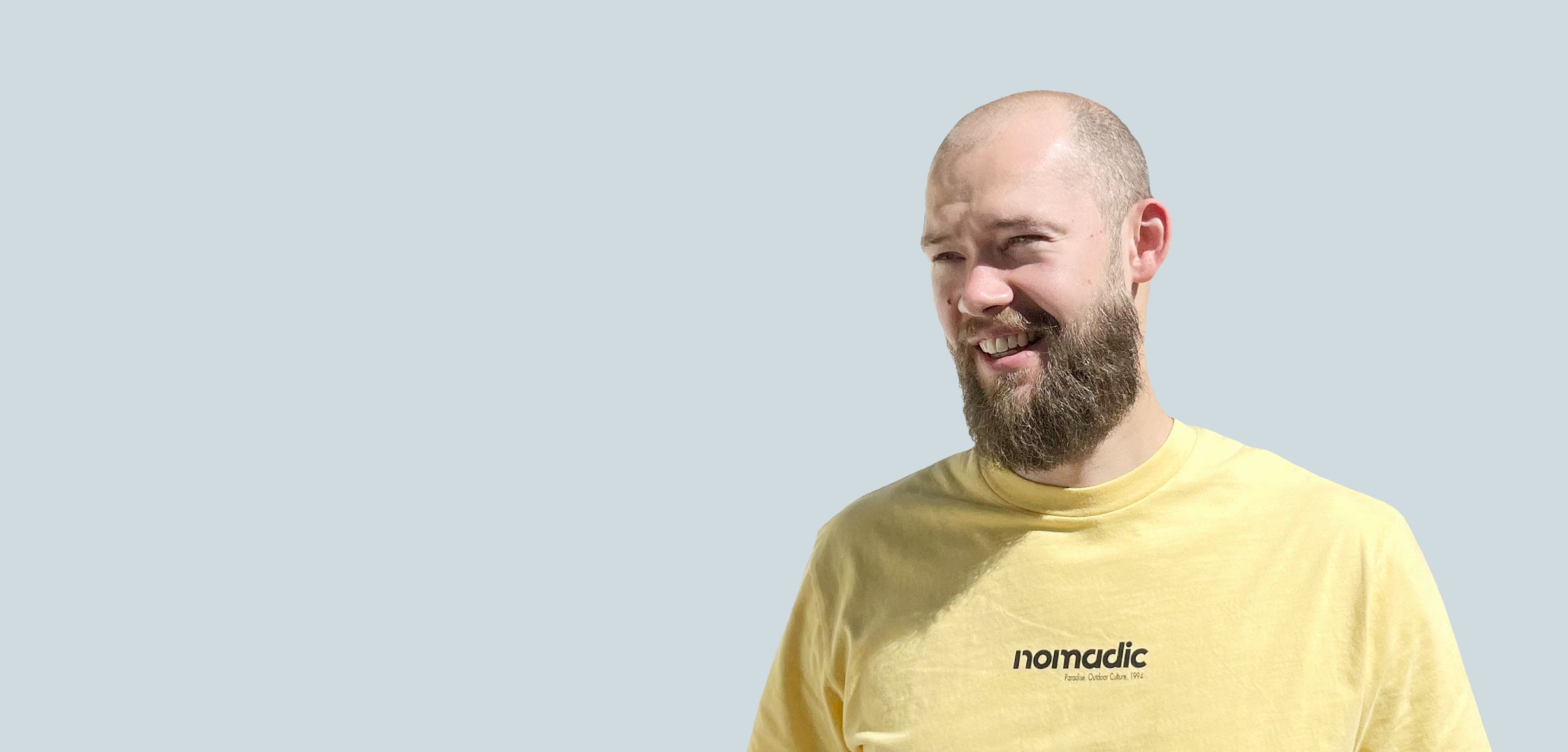 Portrait photo of Vlad Kutepov web designer on a black studio background
